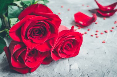 Red roses flowers with red hearts