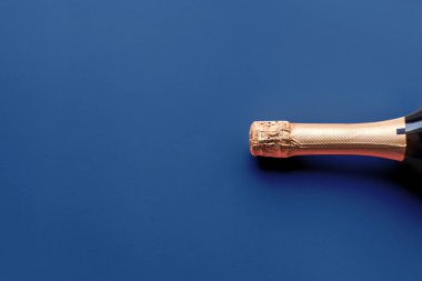 Champagne bottle on classic blue background