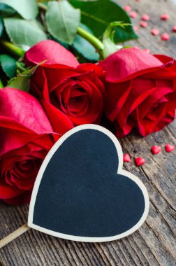 Red roses flowers with red hearts