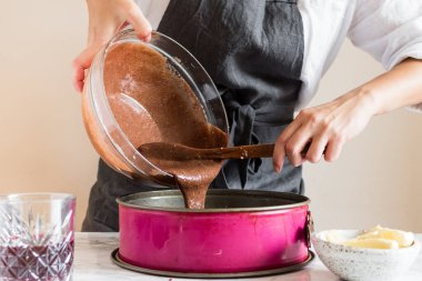 Woman making cake in her kitchen