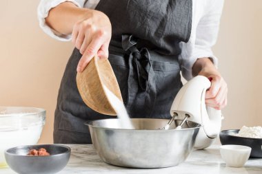Woman making cake in her kitchen