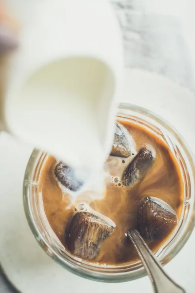 Pouring Milk Jug Glass Espresso Ice Cubes White Background Copy — Stock Photo, Image