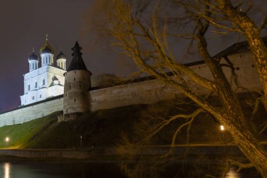 Night view of the Pskov Kremlin. In the foreground is a river