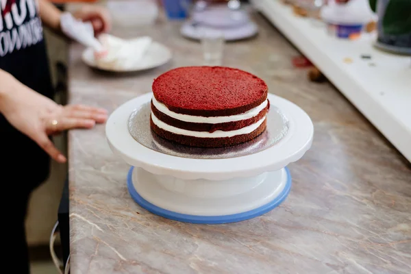 Red velvet cake. The process of making a cake is red velvet.