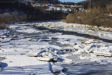 The frozen river Prut in the Carpathian village of Yaremche. Ukraine