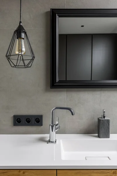 Gray bathroom with mirror — Stock Photo, Image