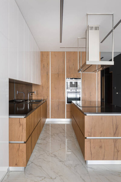 Stylish kitchen with wooden furniture