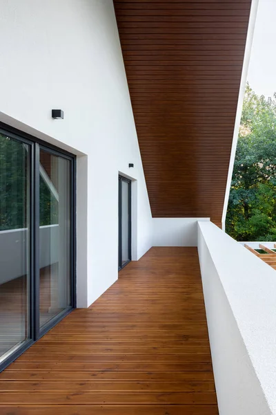 Long home terrace on top floor with wooden ceiling and flooring