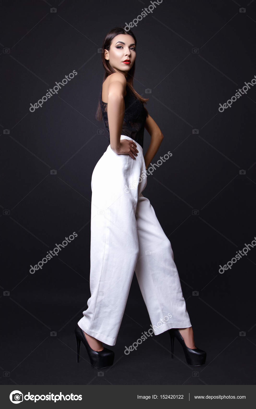 black blouse and white pants