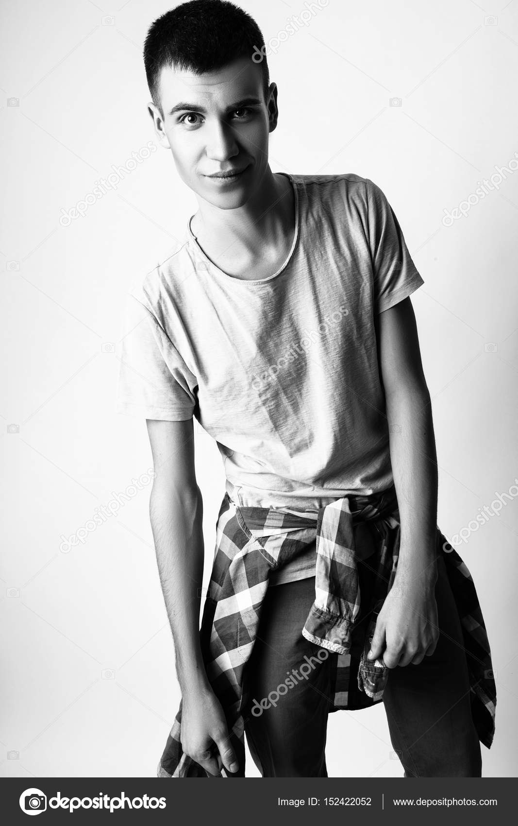 Fashion photo of young model man on white background. Boy