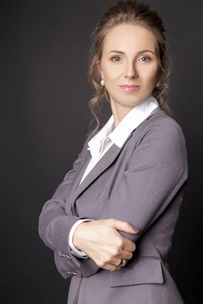 Business lady in suit  on black background — Stock Photo, Image