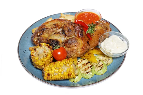 A large piece of meat with corn and potatoes — Stock Photo, Image