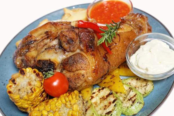 A large piece of meat with corn and potatoes — Stock Photo, Image