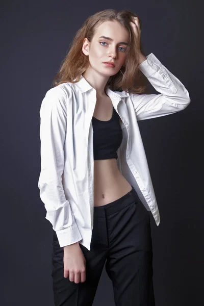 Young girl model in studio on black background — Stock Photo, Image