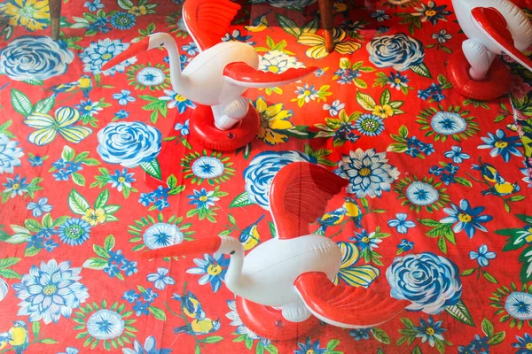 Plastic Toys in a Flower Cloth Pattern