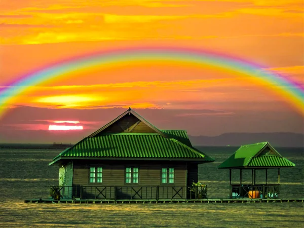 raft house on the sea and sunset