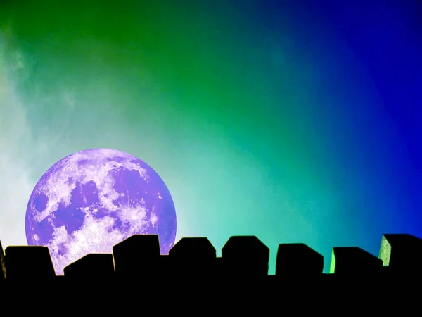 Full moon silhouette of top wall and colorful sky in night — Stock Photo, Image
