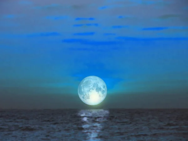 super blue moon rise from sea in night time