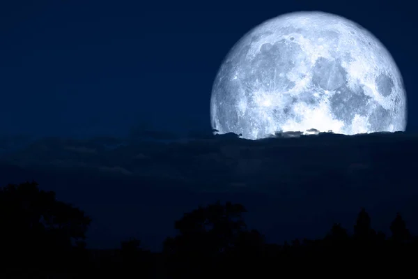 Full lenten moon back on silhouette cloud and mountain on night — Stock Photo, Image
