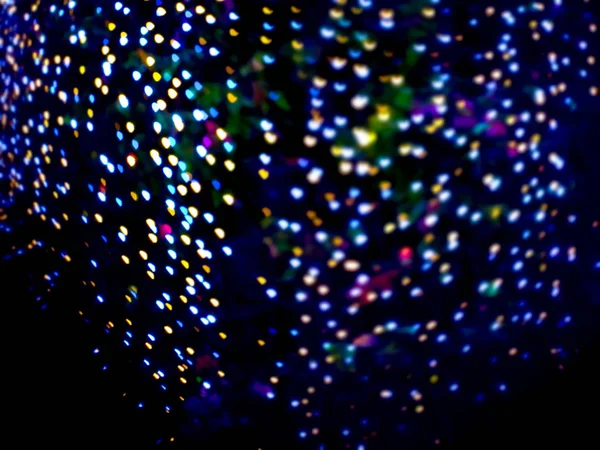Abstract rainbow blur heart shape love night light on tree the i — Stock Photo, Image