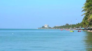 banana boat parking near Bang San beach and bird on sea