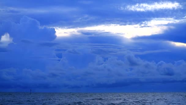 Dark storm cloud on sea and cargo ship is parking on horizon — 图库视频影像