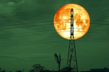 Full Blood Worm Moon and silhouette power electric pole and nigh