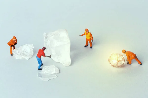 Miniature toy workers crash the ice and adamant — Stock Photo, Image