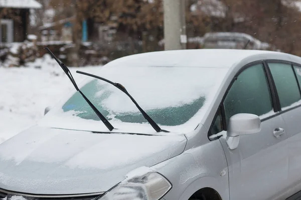 Windshield wiper raised up.