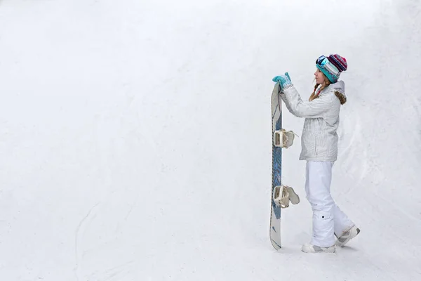 winter, sport concept, happy young woman with snowboard outdoors