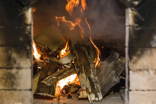 Birch wood burning in the Russian oven