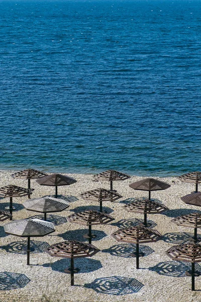 Umbrellas awnings on the winter beach — Stock Photo, Image