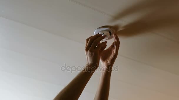 Mens Hands Twist The Light Bulb In The Ceiling Close Up 4k Electric Energy Saving Lamp