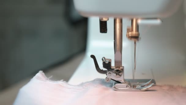 Woman sewing light fabric on a sewing machine close-up. Side view. Stock  Video Footage by ©familylifestyle #185667492