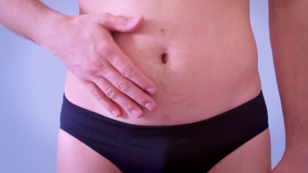Man in underpants touches his flabby fat naked stomach, closeup view. — Stock Footage Man in underpants touches his flabby fat naked stomach, closeup view. Stock Footage