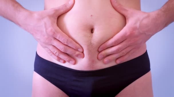 Slim man in underpants touches his flabby fat naked stomach, closeup view. — Stock Footage Slim man in underpants touches his flabby fat naked stomach, closeup view. Royalty Free Stock Footage