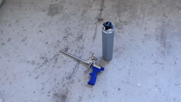 Bottle of spray with construction foam and instrument tool for repair room. — Stok video