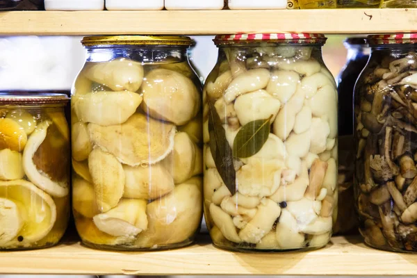 Russian products, pickled mushrooms in glass jars. raditsionny w — Stock Photo, Image
