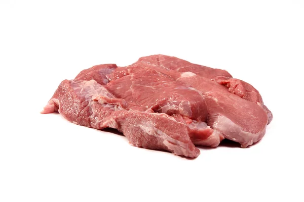 Сырое мясо свинины (задняя нога) разрезано на ломтики, лежащие на белом заднем сидении — стоковое фото
