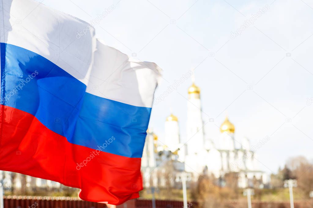 Russian flag on the background of the Moscow Kremlin