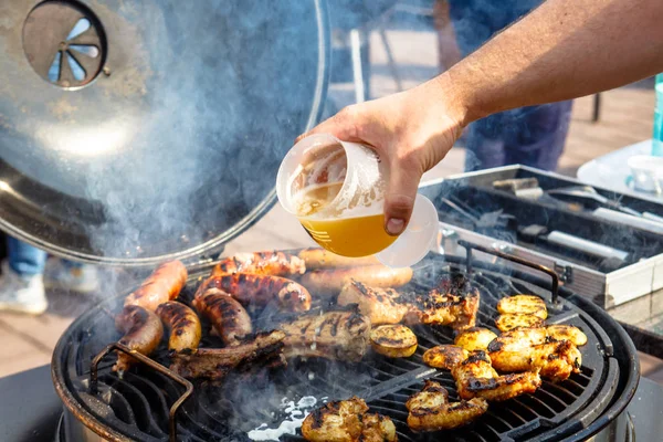 Meat, sausages and vegetables cooked on the grill. Barbecue. — Stock Photo, Image