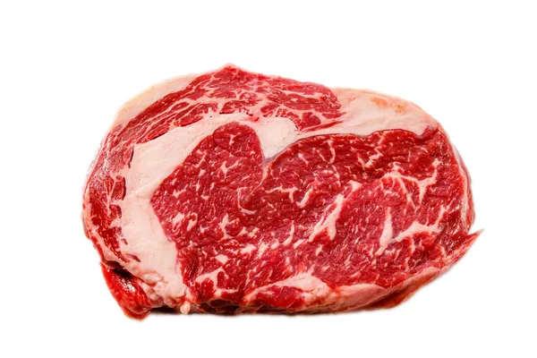 A rib eye steak of marbled grain-fed beef lies on a white backgr — Stock Photo, Image