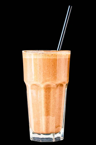 Brown Smoothie or cocktail with coffee and yogurt in a large glass glass on a black background, isolated.