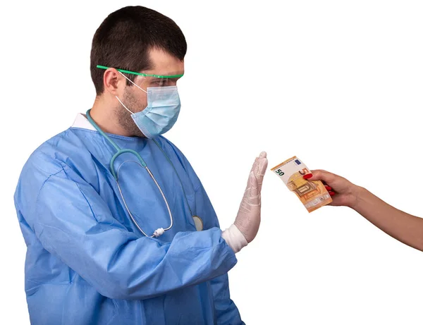 Doctor in surgical gown with stethoscope, mask and goggles refusing money for coronavirus treatment. Patient giving euro for medical services against Covid-19, isolated on white background