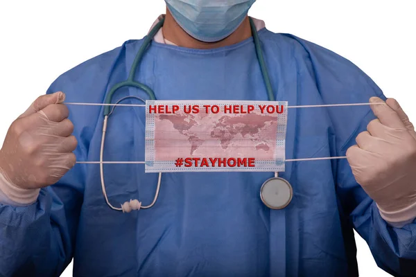 Concept of Coronavirus world pandemic, Help us to help you, Stay Home. Doctor with biohazard protection clothing of Covid-19 contamination is holding a surgical mask on which the world map is drawn