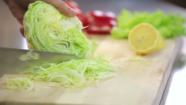 Chef cooking fresh crispy iceberg salad slowmotion — Stock Video