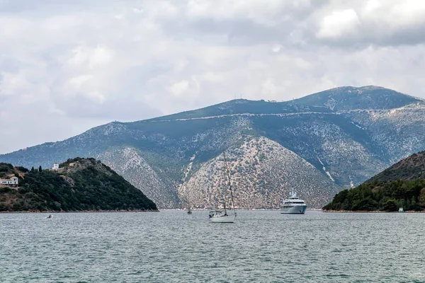 Boats in the gulf Vathy with little island near Ithaka island in Greece