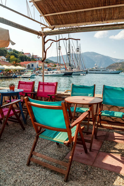 Outside traditional tavern restaurant near the sea, near yacht marina in Town Vathy, Ithaka island, Greece