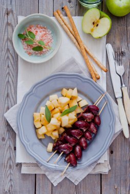Grilled chicken hearts on skewers with stewed apples clipart
