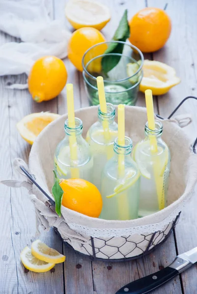 Basket lemonade bottles — Stock Photo, Image